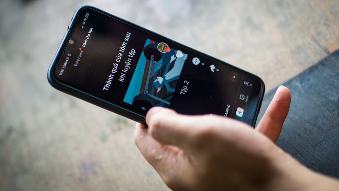 person scrolling news on smartphone