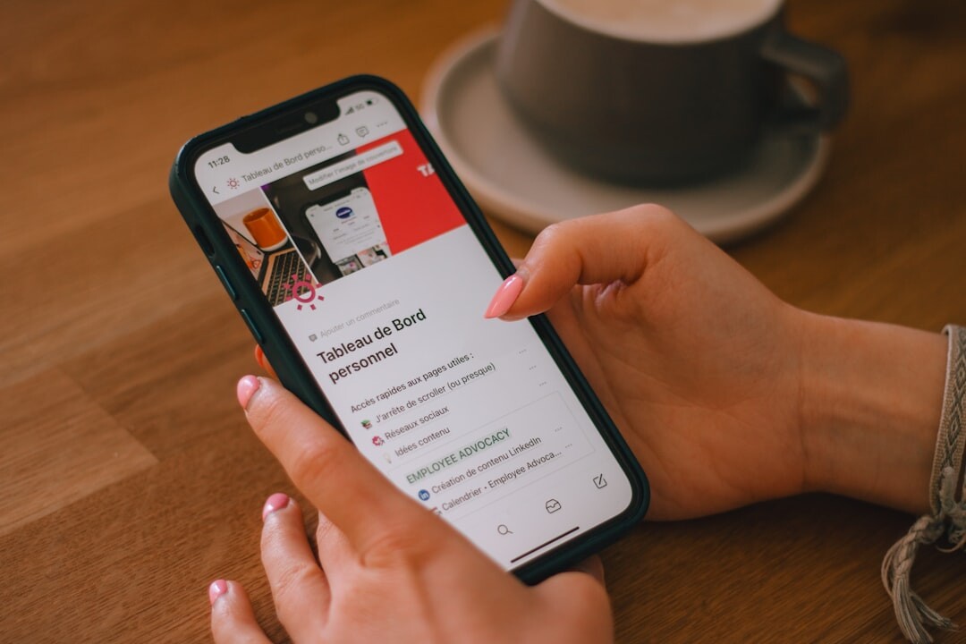 person scrolling phone news app
