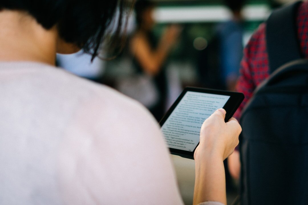 person using e-reader