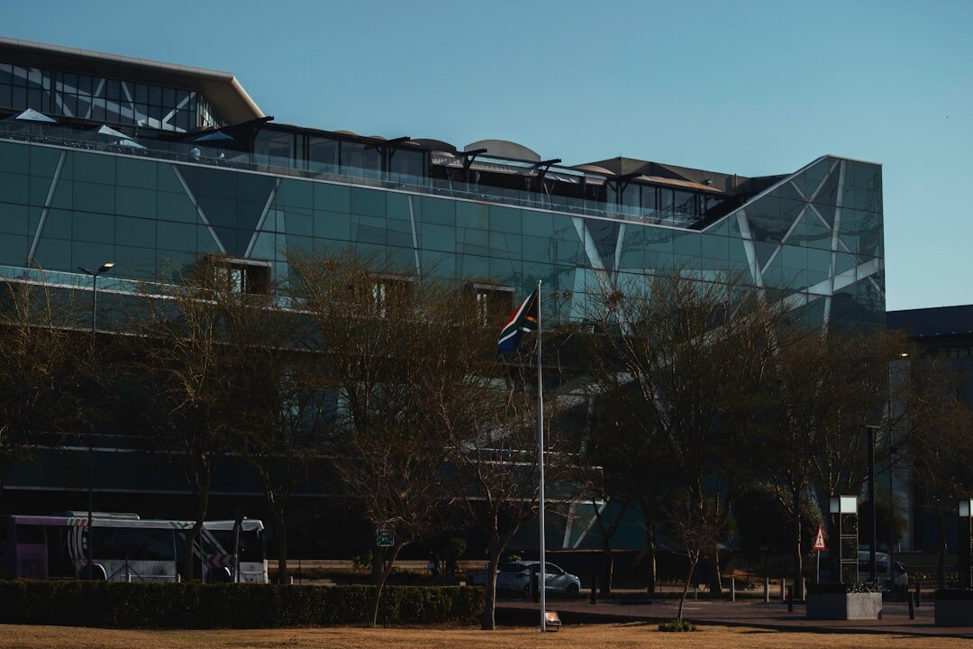 Modern glass office building exterior in a South African business district